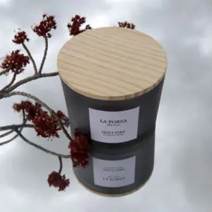 A candle that is sitting on top of another candle.